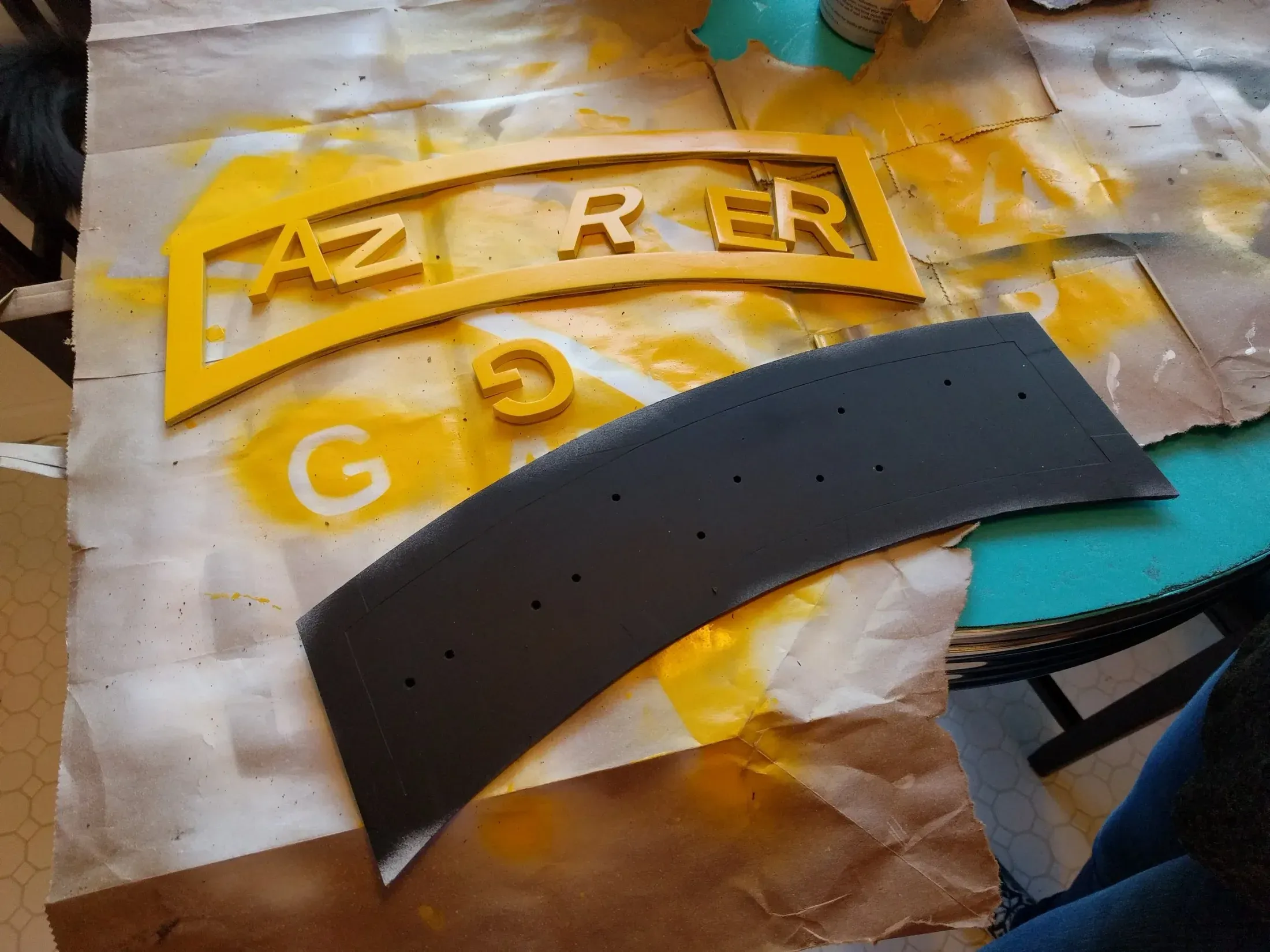 Primed and painted tab components before final assembly