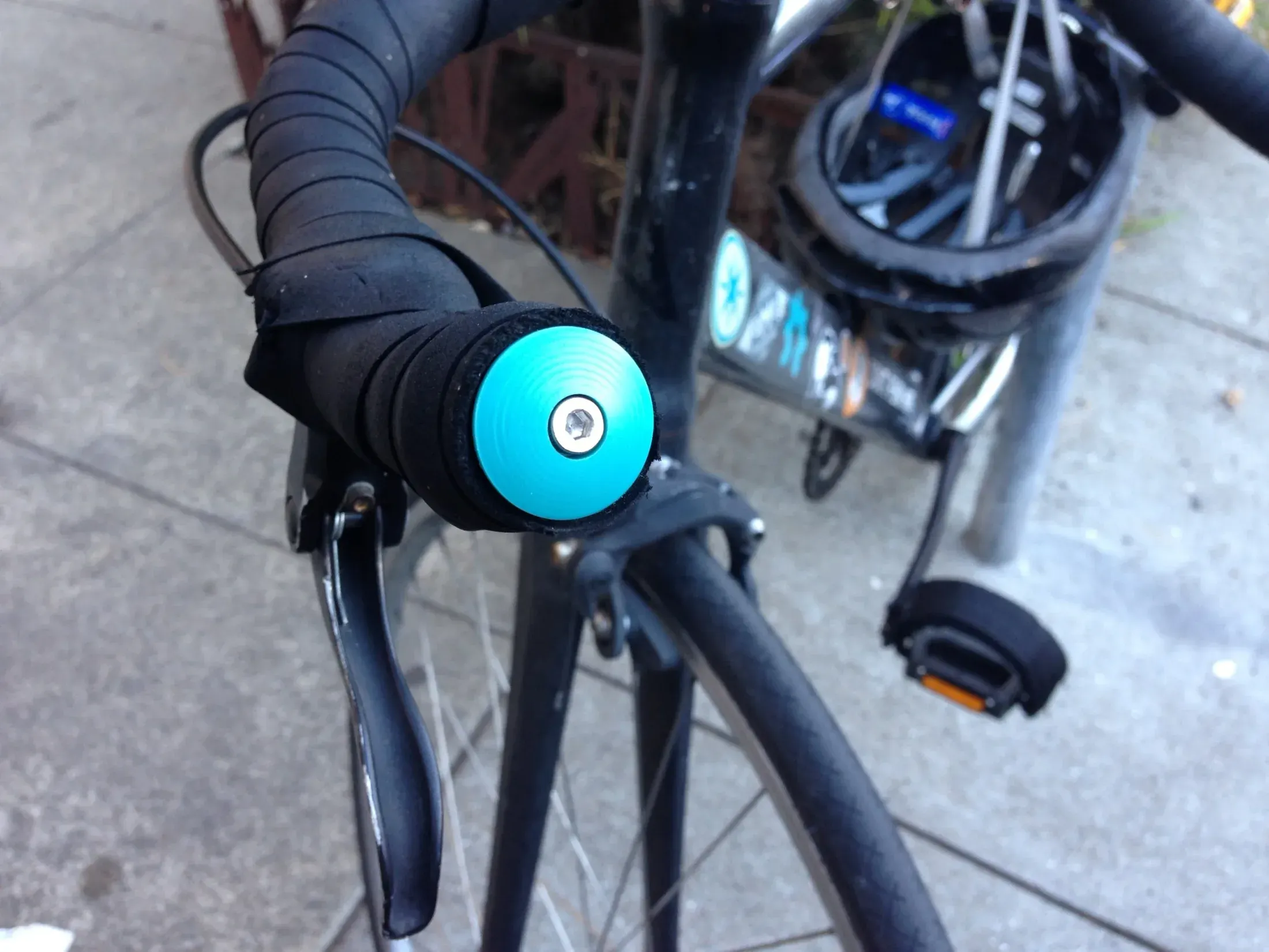 Finished custom handlebar plugs installed with center bolts