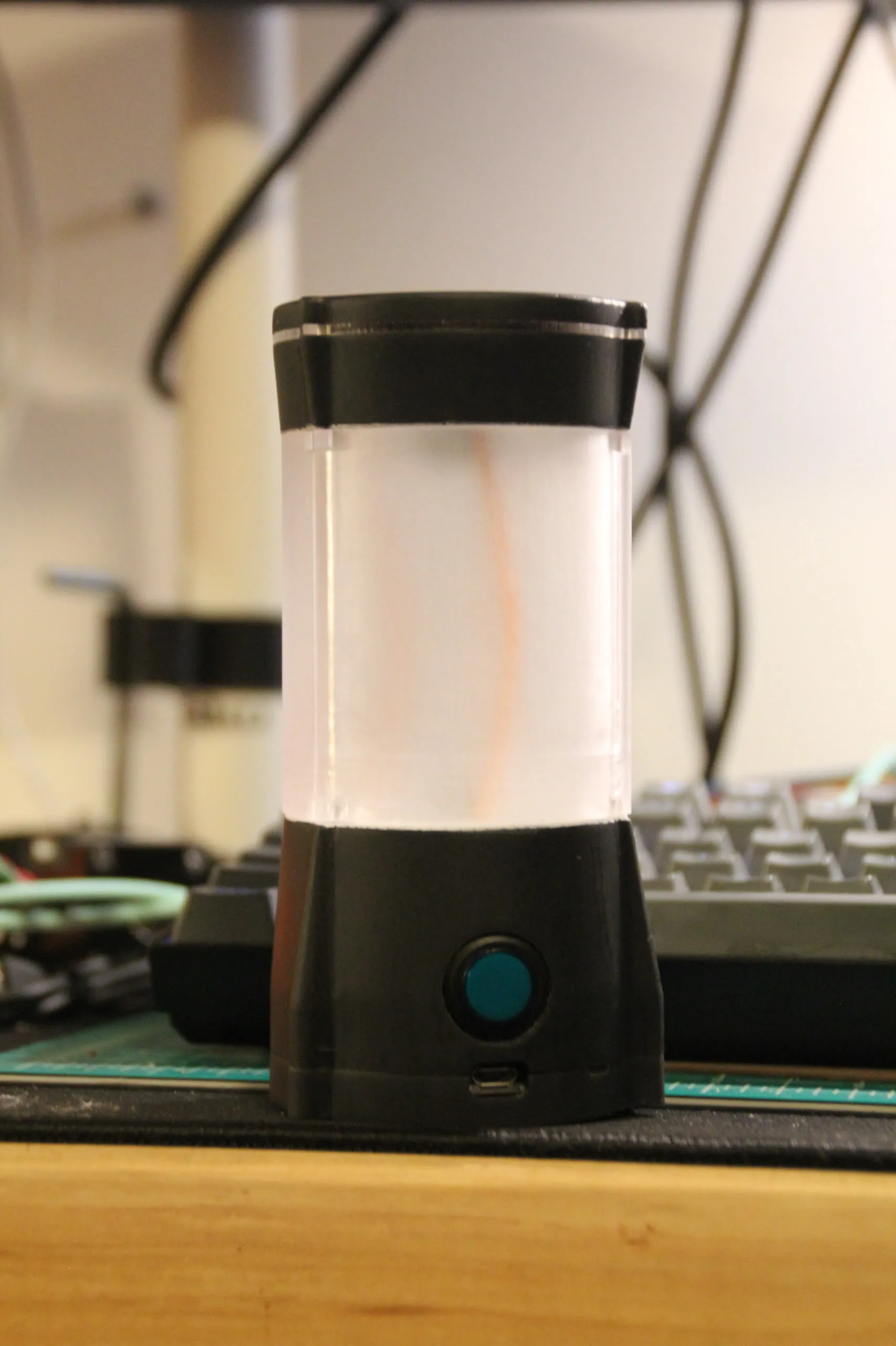 The assembled lamp switched off on a workbench.
