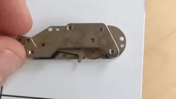 Sector gear and main gear reassembled between indicator plates