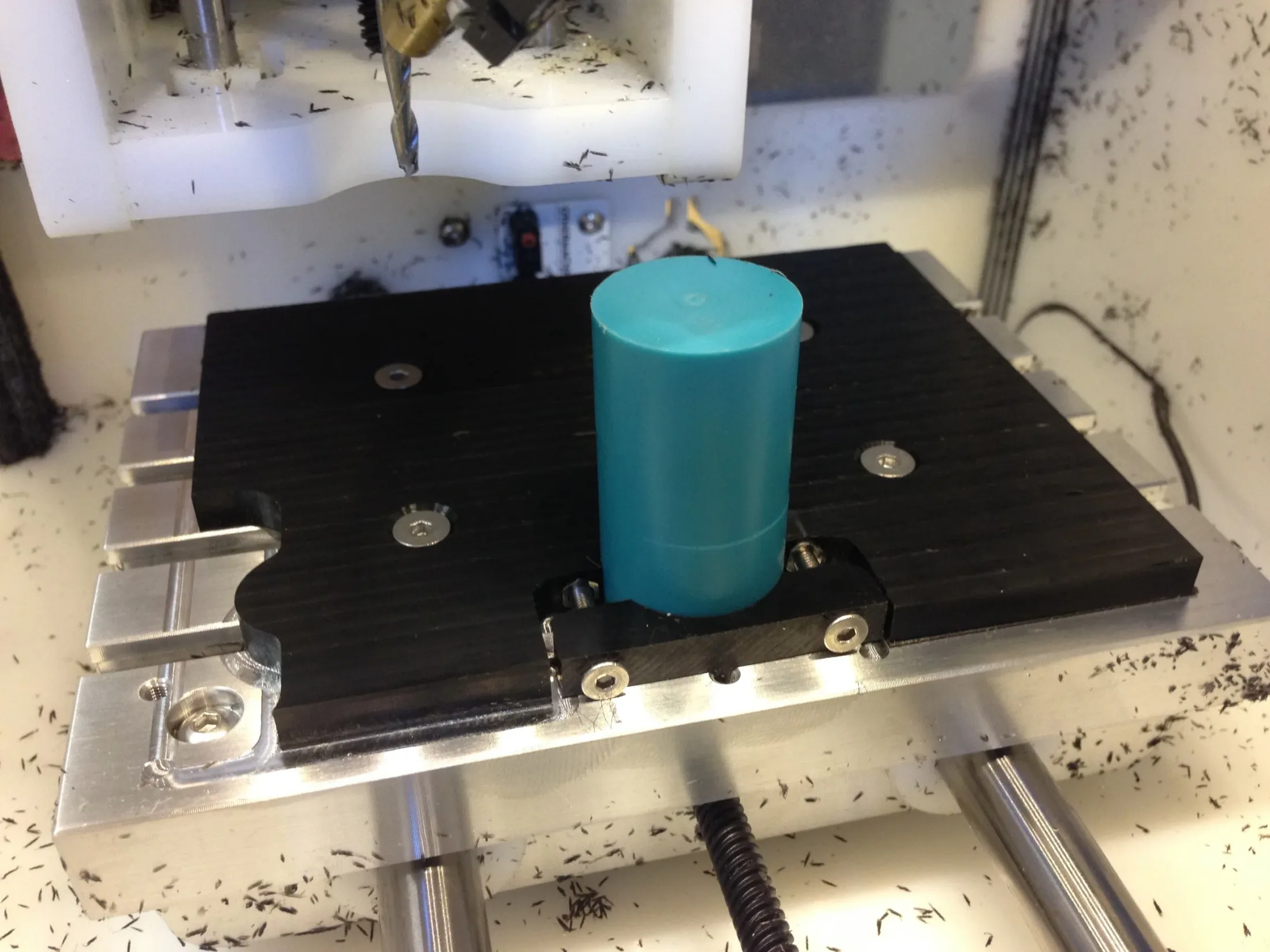 Delrin stock clamped in custom fixturing plate for Op 1