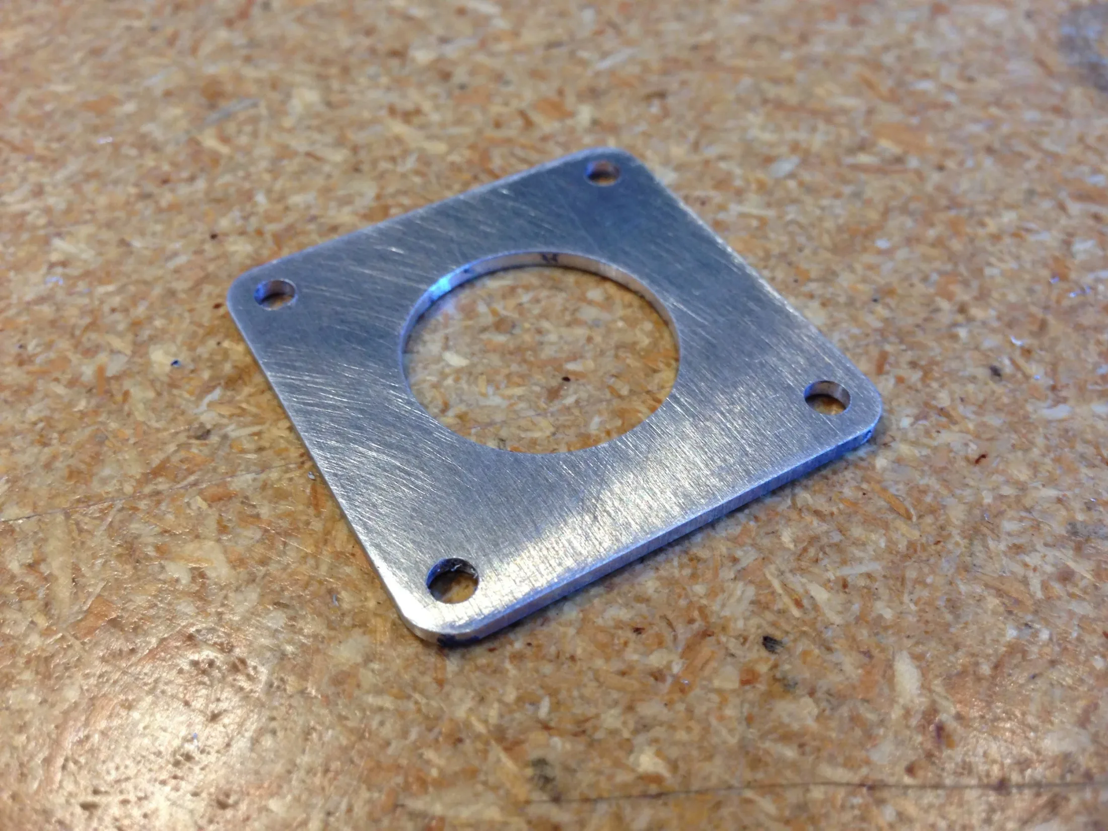 Aluminum hold-down cap for Op 3 fixture