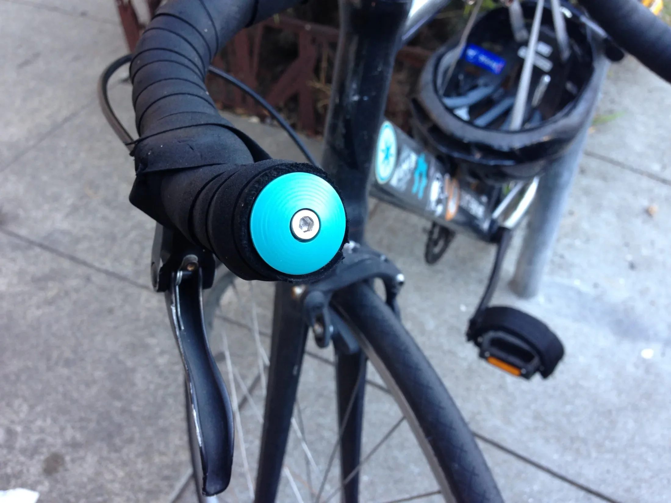 Finished custom handlebar plugs installed with center bolts