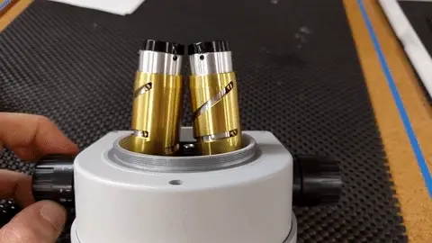 CAD view of eyepiece optics and cam-follower arrangement