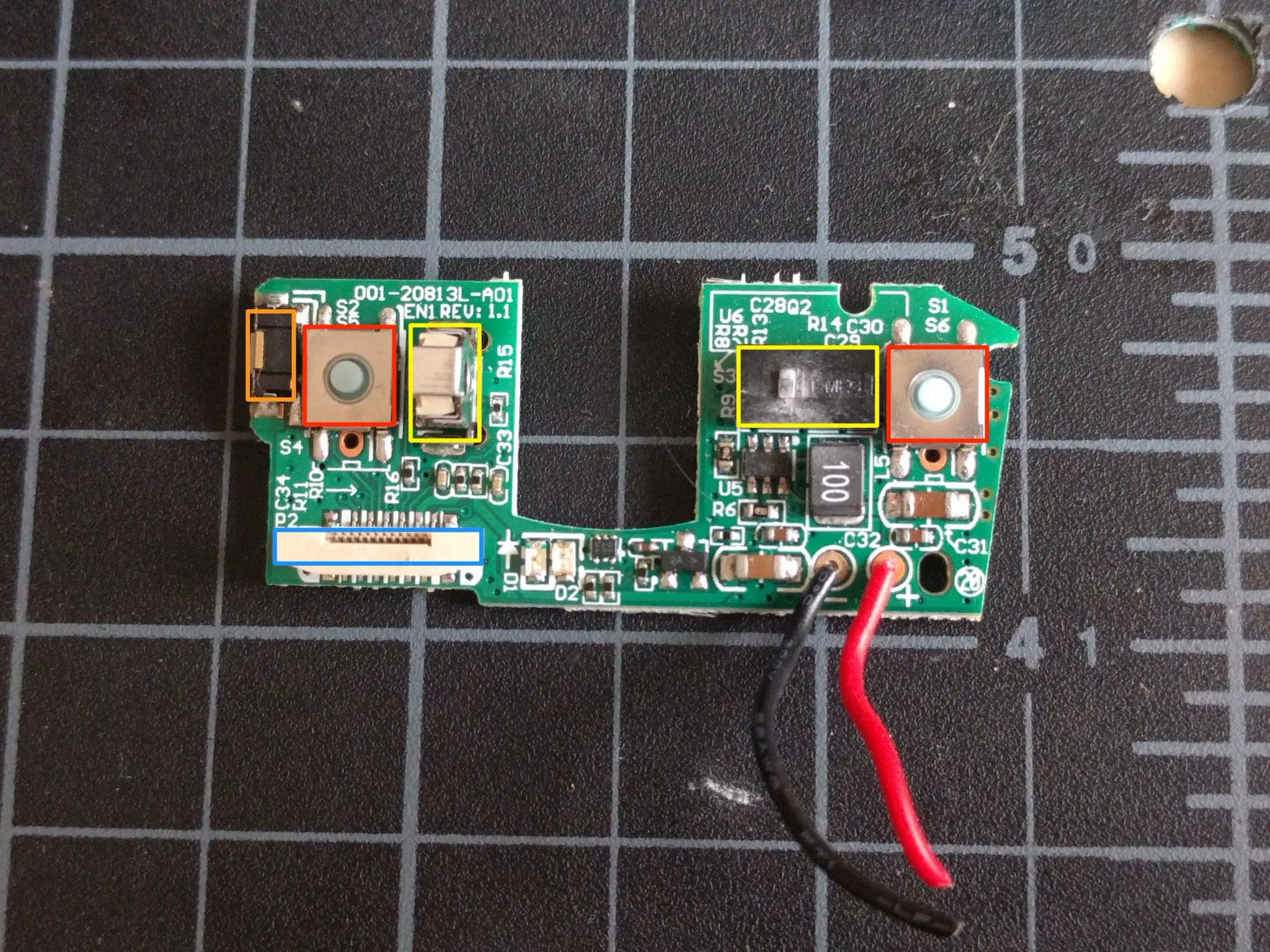 Top PCB annotated with click switches and ribbon connector